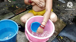 Indian bhabhi bathing outside with