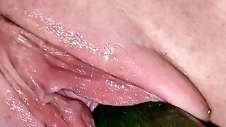 Penetration wet pussy by big cucumber