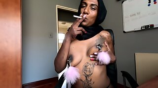 Desi in hijab smoking while wearing nipple clamps