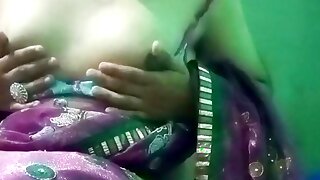 Indian Gay Crossdresser in pink saree pressing and milking his boobs so hard and enjoying the hardcore sex