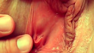 Guy jerks off and cums all over a shaved pink pussy