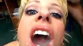 Blonde ends with lots of cum on her face in bukkake vid