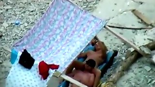 Voyeur tapes a nudist couple having oral sex at the beach