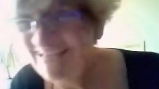 Granny has cybersex with a stranger on cam and flashes her big boobs