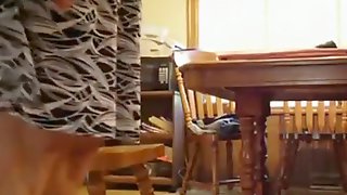 Milf rides her husband upskirt on a chair in the kitchen