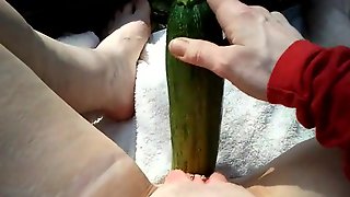 Chubby mature masturbates with giant cucumber