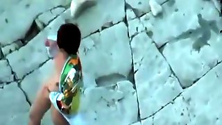 Voyeur tapes a mature couple having sex in public at the beach