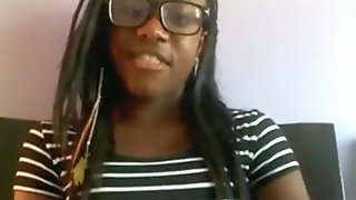 Black nerd with glasses masturbates with a hairbrush on her bed on skype