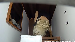Hidden camera shows a hot blonde in a massage salon