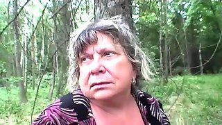 Busty granny having fun in the forest