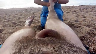 Nude massage on the beach