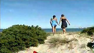Young and mature lesbians peeing at the beach