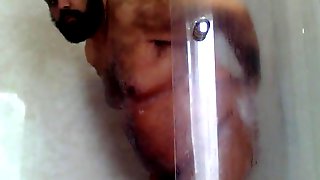 Naked old guy masturbates his fat pecker while showering