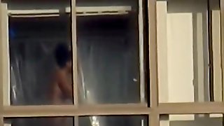 Ebony spied through her apartment window