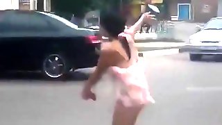 Drunk girl shows off in the evening on the streets