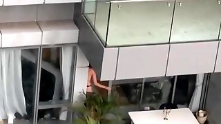 Neighbor spied topless in balcony