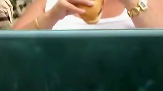 Mature exhibitionist eating sandwich