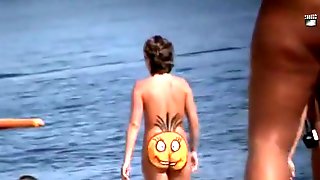 Nudist woman smile on her butt