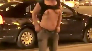 Drunk girl stripping in front of a club