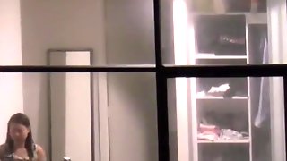 Girl spied through hotel bedroom window