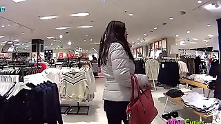 Cute girl in a boutique sucks dick guy for money