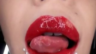 Horny dark haired Japanese girl testing her lipstick