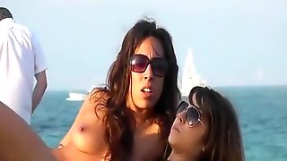 Topless lesbian brunettes at beach
