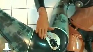 Submissive lesbian slut anal inflatation in latex black bodysuit