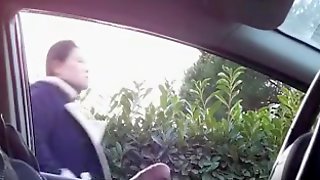 Sitting in a parked car and masturbating cock