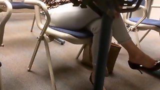 Candid dangling heels under the table coworker lunch