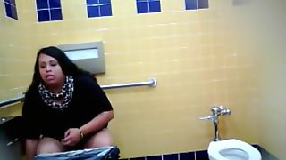 Lovely Brazilian fattie gets recorded urinating hard in a public restroom