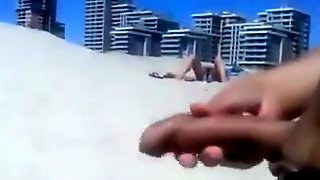 Masturbating to a stranger on the beach