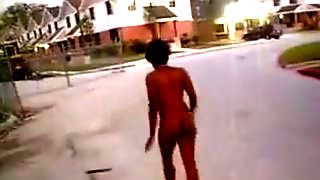Ebony babe walks naked on the street