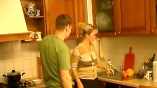 Teen guy covets to blonde milf and fucks her in kitchen