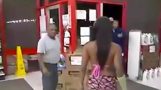 Ebony woman in a bikini beats the man with her purse