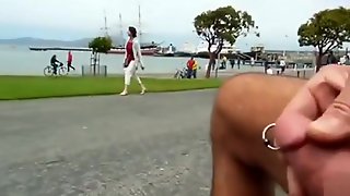 Stroking the pierced penis on the coast