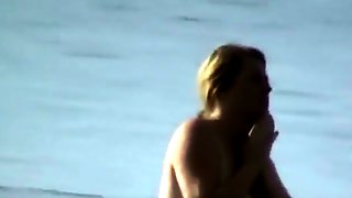 Milf with saggy tits goes skinny dipping in the ocean