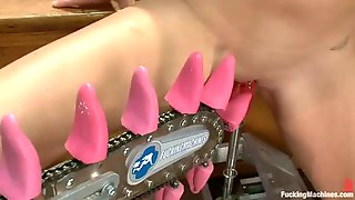 Blonde babe kelly surfer gets her pierced pussy stimulated by machines