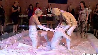 Lesbian mud fighters ripping each other's clothes off