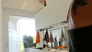 Secretly filmed my milf wife in the kitchen