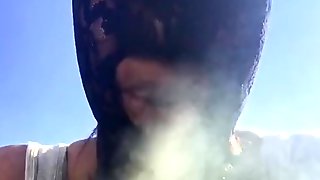 Masked Ebony BBW smoking, sucking & playing with vibrator in garden