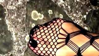 Walking outdoor on the Stairs in Fishnet Catsuit Black Toes