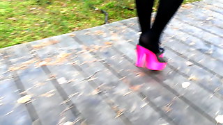 Lady L walking with pink mules.