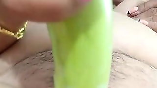 Thai Grandma masturbate with cocumber