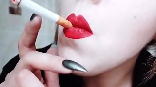 MISTRESS WITH LUSCIOUS RED LIPS CLOSE-UP SMOKING CIGARETTE
