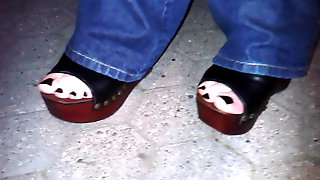 Platform wedges and black toenail polish