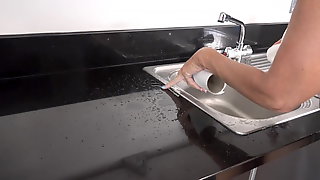 Mature granny pissing in sink