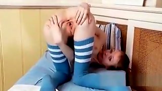 Teen beauty flashes pink cunt while stretching