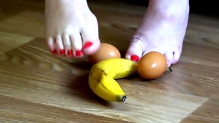 Fat legs bare feet mercilessly trampled banana and raw eggs. Crush Fetish.