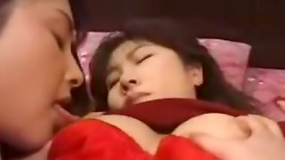 Asian lesbian sucks and fucks with a strapon Uncensored